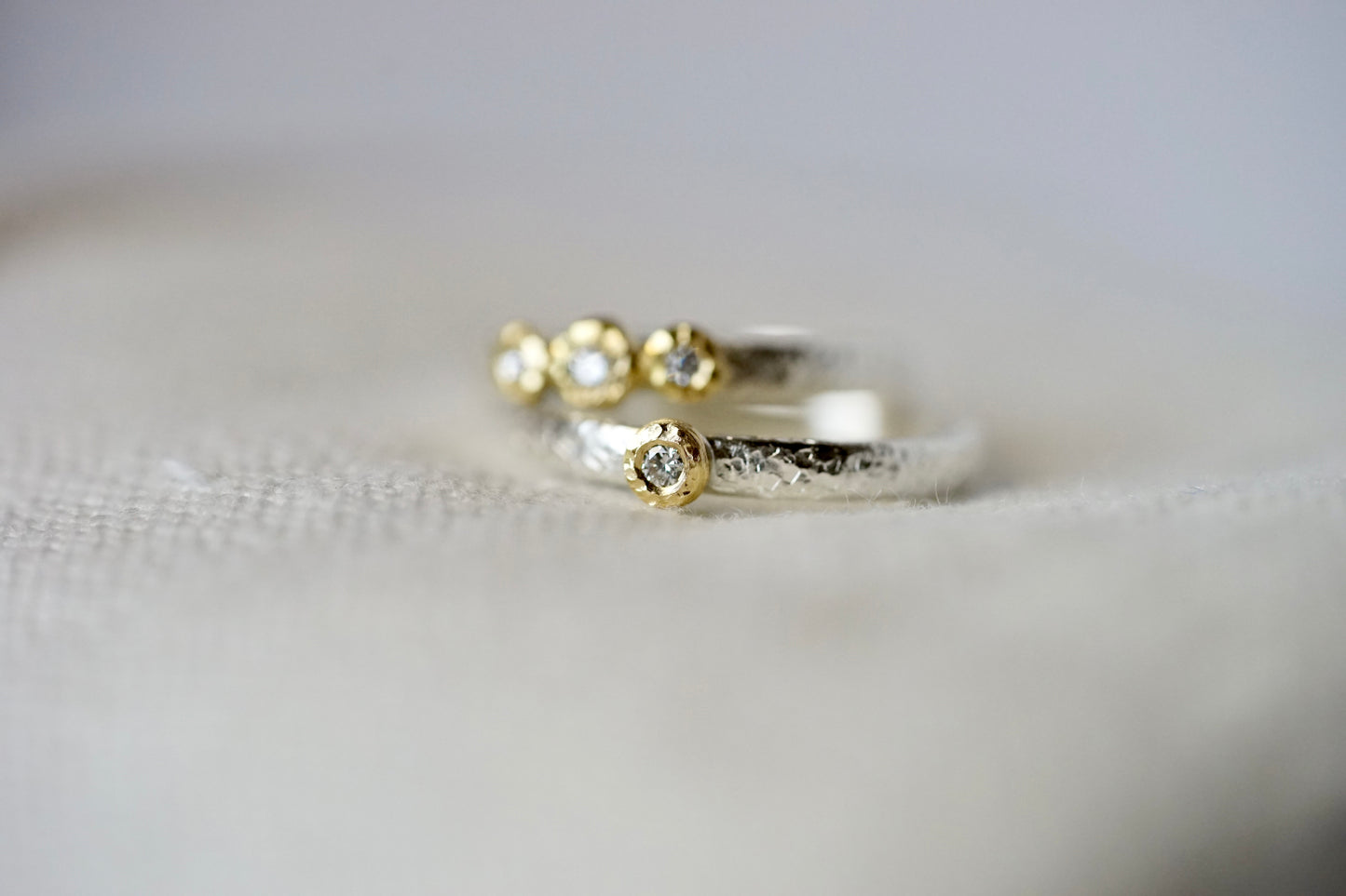 18ky 3-bezel Ring 0.07ct diamond with sterling silver band - size 5.5