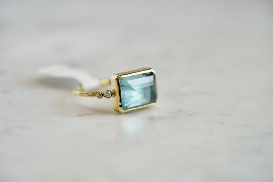 Emerald Cut Aqua Ring with 14k textured band and bezel