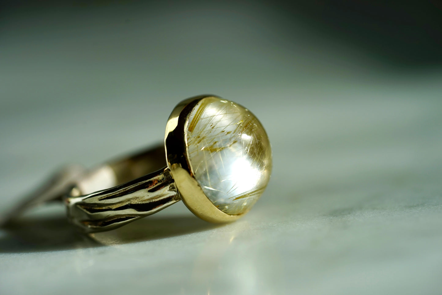 14KSS Rutliated Quartz Rowan ring with gold bezel and sterling band