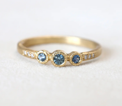 3 bezel 18ky Ring - 0.17ct Montana Blue Sapphire with 0.03ct diamond - size 6.5