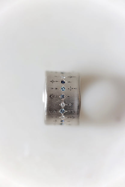 Adel Chefridi - Wide Silver Band with single stone line patter in sapphire, aquamarine, and diamond