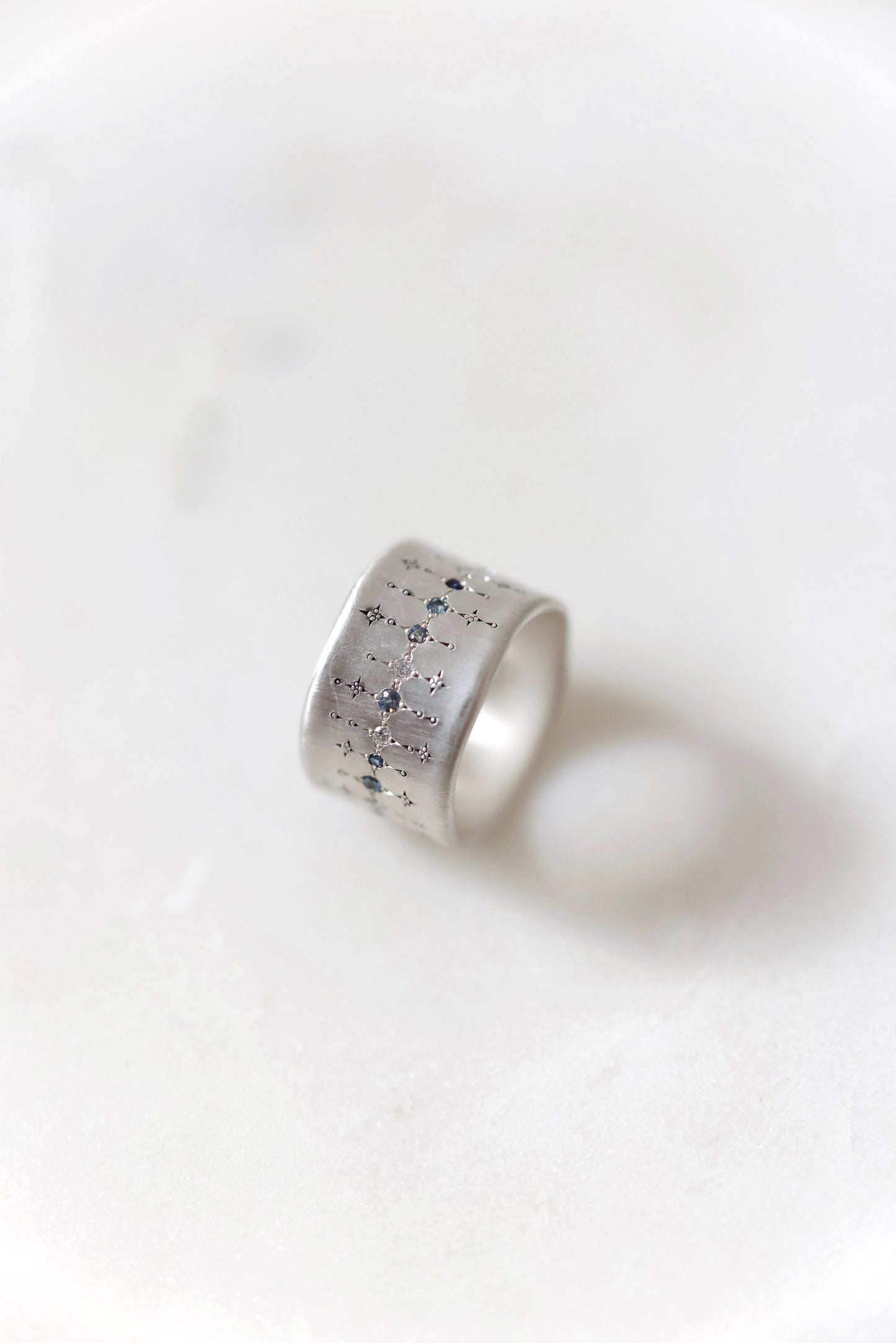 Adel Chefridi - Wide Silver Band with single stone line patter in sapphire, aquamarine, and diamond