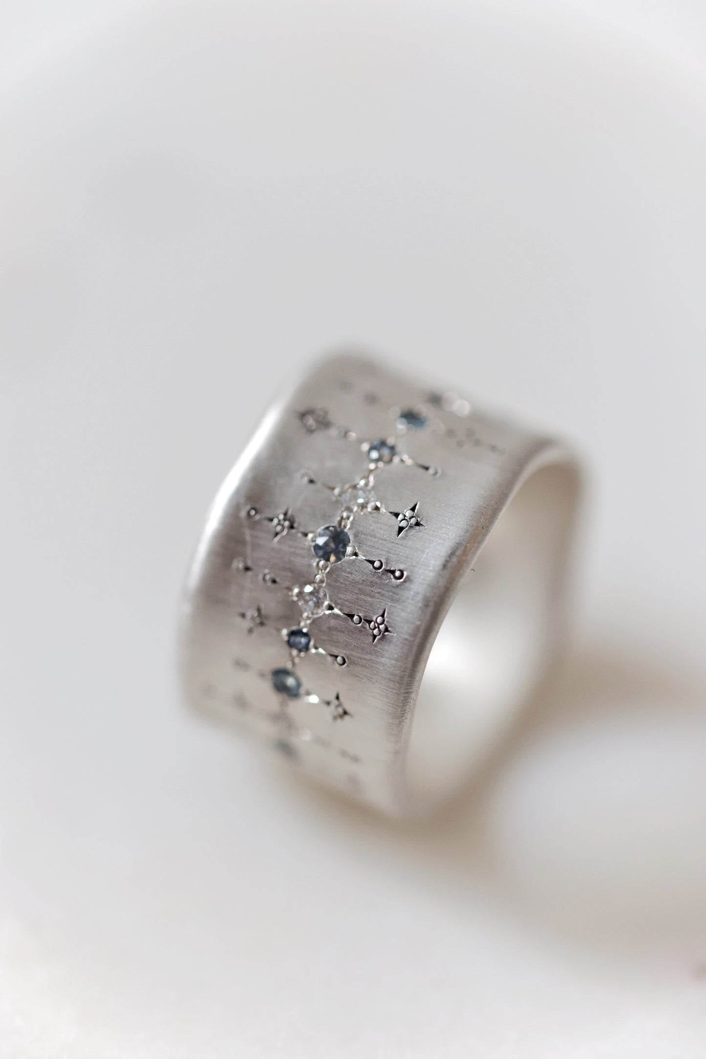 Adel Chefridi - Wide Silver Band with single stone line patter in sapphire, aquamarine, and diamond