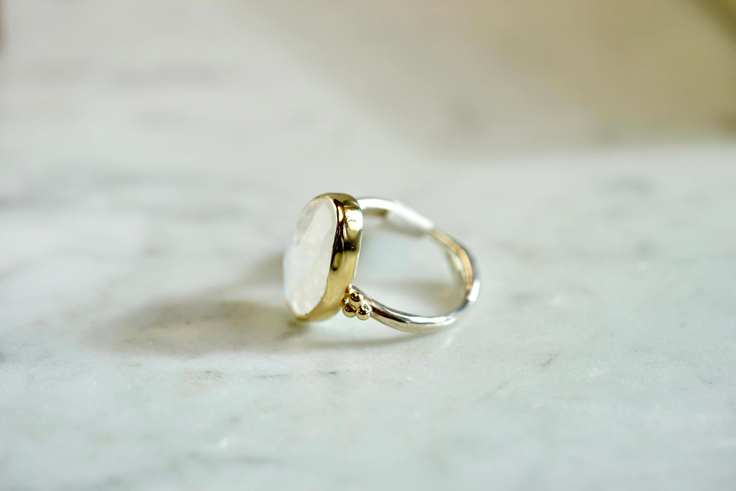 Rainbow 8.5ct Moonstone nestle ring w/14k bezel and sterling band - size 7.75