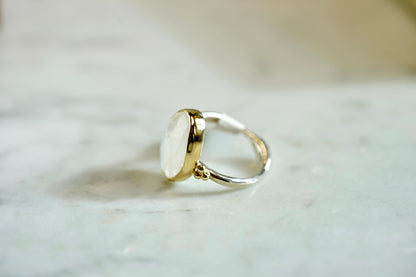 Rainbow 8.5ct Moonstone nestle ring w/14k bezel and sterling band - size 7.75